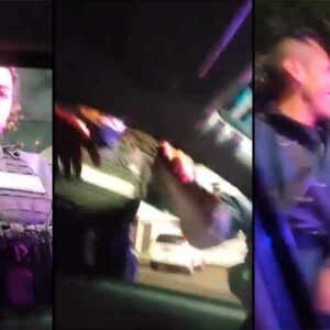 policías de Naucalpan amenazando y rociando gas a un automovilista